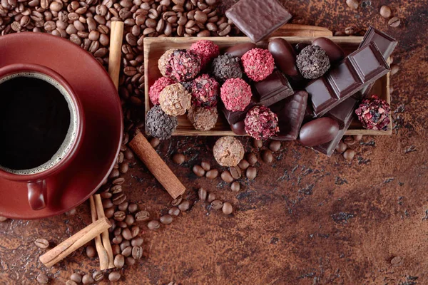 Various Chocolates Cup Black Coffee Sweets Cinnamon Sticks Coffee Beans — Stock Photo, Image