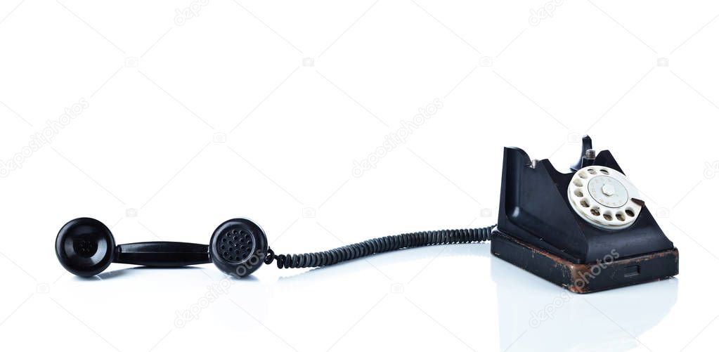 Old black phone isolated on a white background.