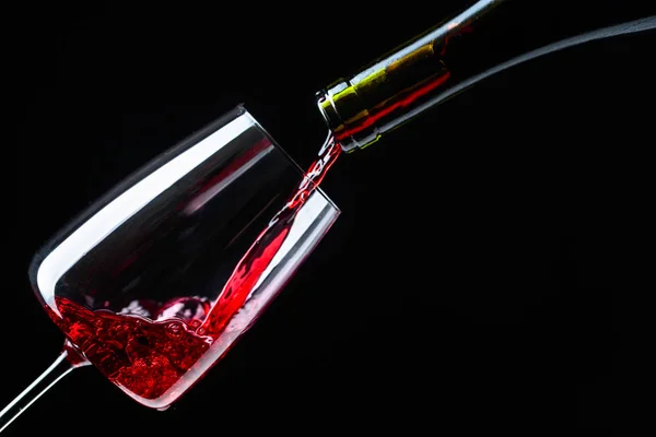 Red Wine Being Poured Wine Glass Black Background — Stock Photo, Image
