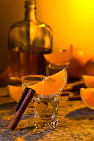 Small Glasses Tequila Orange Slices Cinnamon Sticks — Stock Photo, Image