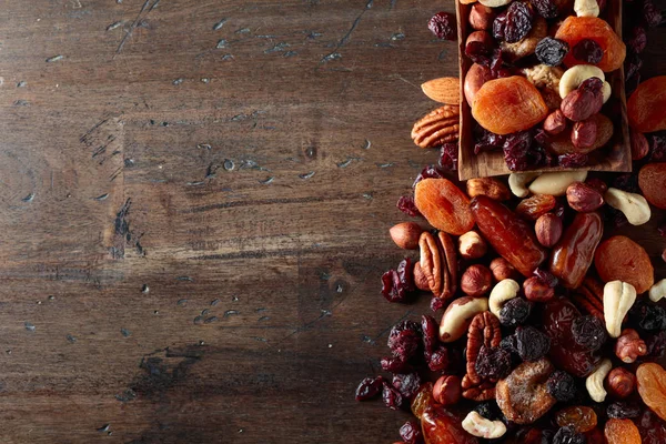 Varias Frutas Secas Frutos Secos Una Mesa Madera Vieja Vista —  Fotos de Stock