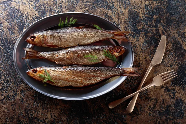 Smoked herring with dill on a metal dish. Copy space for your text. — Stock Image Smoked Herring Dill Metal Dish Copy Space Your Text Royalty Free Stock Images