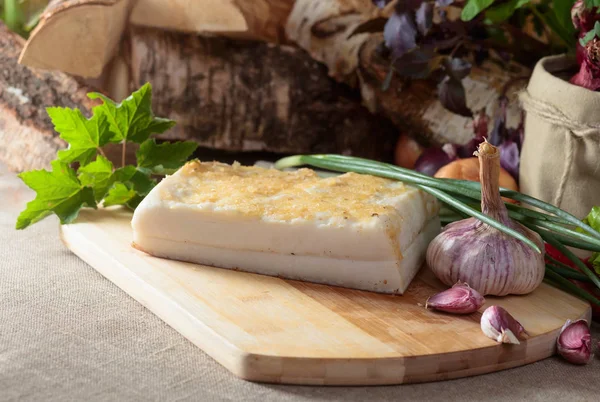 Piece of lard with garlic and spices on a kitchen table. Home kitchen. — Stock Image Piece Lard Garlic Spices Kitchen Table Home Kitchen Stock Photo