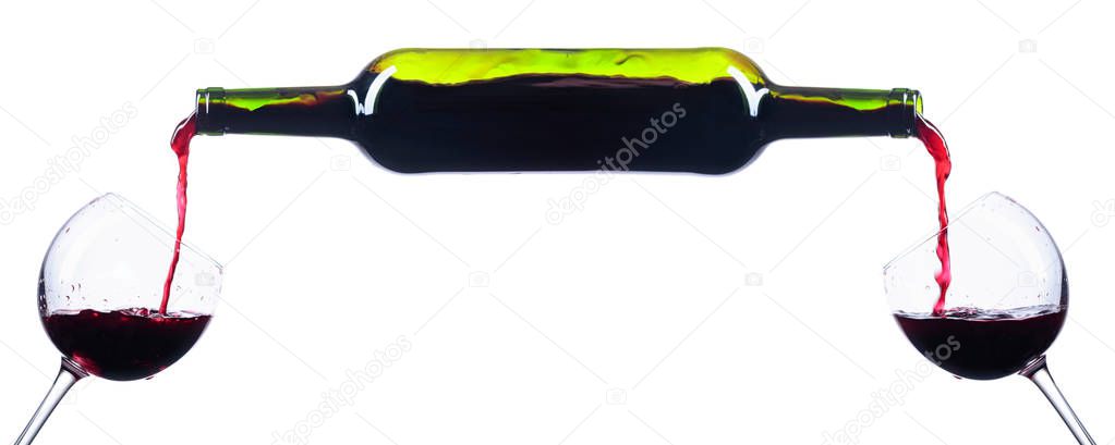  Pouring red wine from bottle to glass isolated on a white background. Conceptual image of the theme of wine. Copy space.
