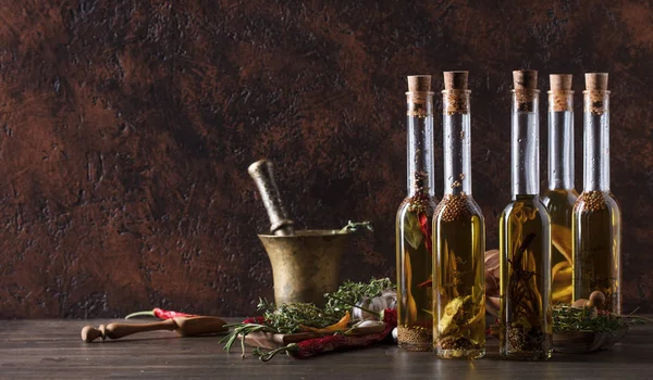 Bottles Olive Oil Old Wooden Table Olive Oil Different Spices — Stock Photo, Image