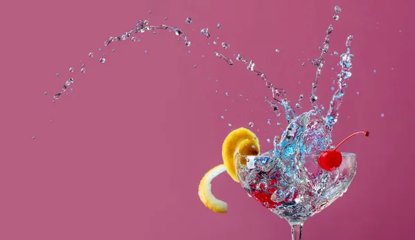 Colorful Cocktail Glass Splashes Garnished Lemon Cherries Purple Background Mixed — Stock Photo, Image