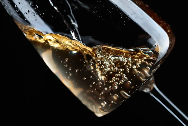 White wine being poured into glass. — Stock Photo, Image