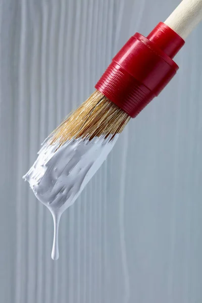 Paintbrush with white paint . — Stock Photo, Image