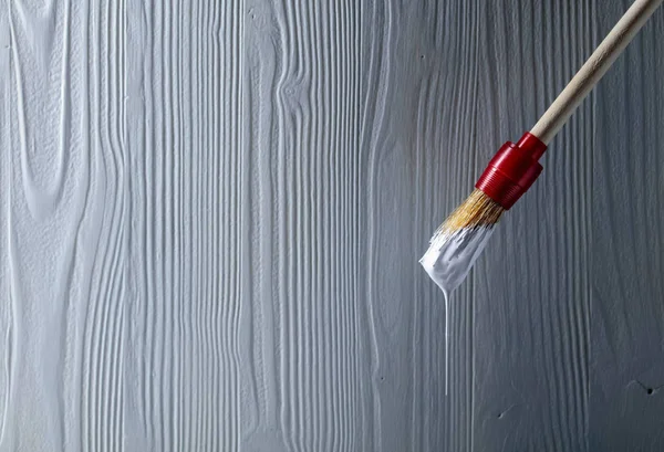 Paintbrush with white paint . — Stock Photo, Image