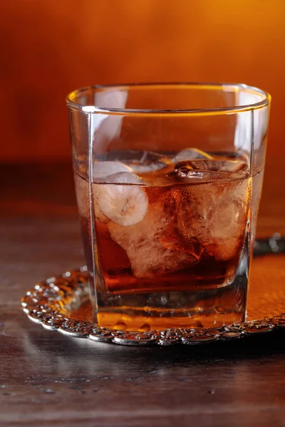 Glass of whiskey with natural ice. — Stock Photo, Image