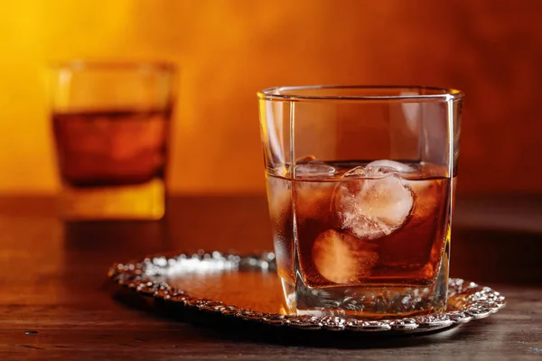 Glass of whiskey with natural ice. — Stock Photo, Image