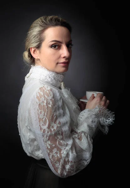 Portrait of a woman in Victorian clothes with a cup of coffee. — Stock Photo, Image