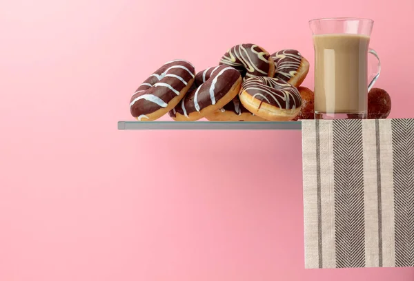 Chocolate donuts and latte on a black background. — Stock Photo, Image
