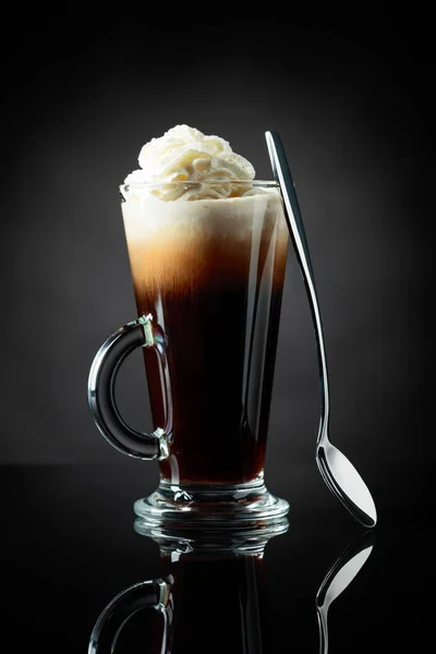 Layered coffee cocktail with whipped cream. — Stock Photo, Image