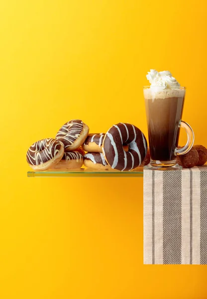 Chocolate donuts and coffee cocktail with cream. — Stock Photo, Image