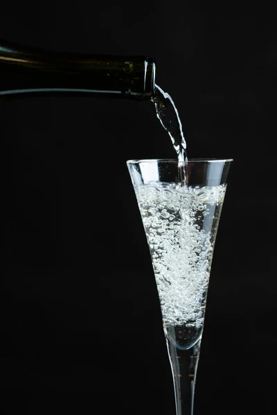 Champagne pouring into glass. — Stock Photo, Image