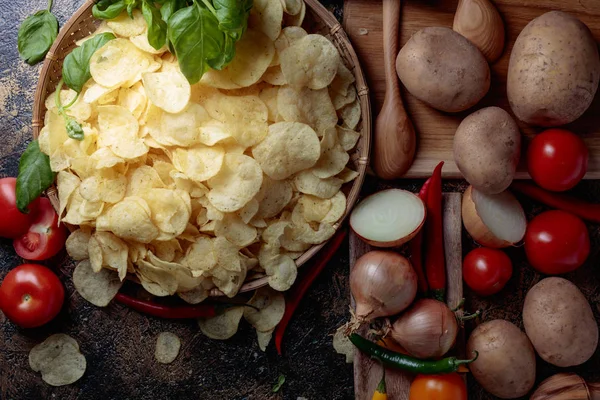 Potato chips with vegetables and spices. — Stock Photo, Image