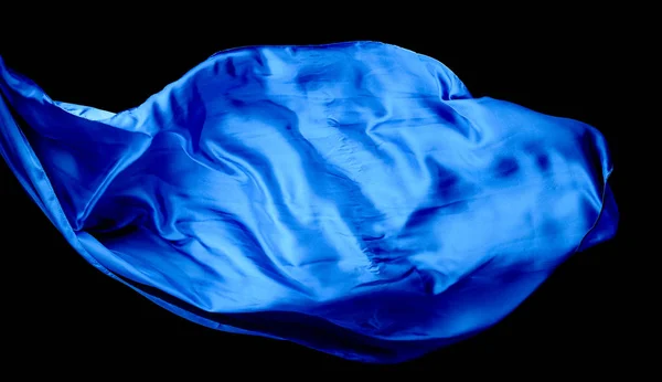 Smooth elegant blue transparent cloth isolated on black backgrou — Stock Photo, Image