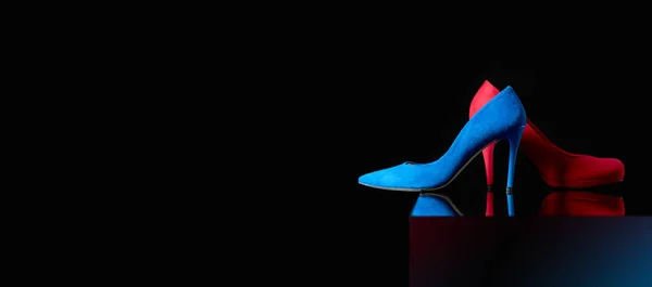 Blue and red women's corduroy shoes on a black background. — Stock Photo, Image