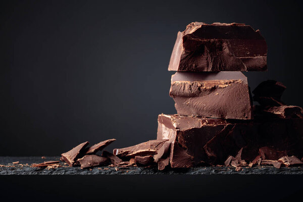 Black chocolate on a dark background. Stock Photo