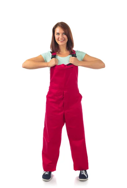 Attractive woman in red overalls, isolated on a white. — Stock Photo, Image