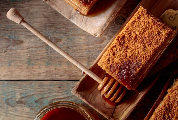 Homemade honey cake  on a old wooden table.