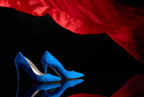 Blue women's corduroy shoes on a black reflective background. — Stock Photo, Image