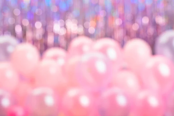 Defocused pink and purple balloons on colorful background. — Stock Photo, Image