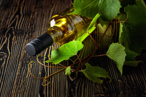 Unopened Bottle White Wine Grapevine Old Wooden Table Copy Space — Stock Photo, Image