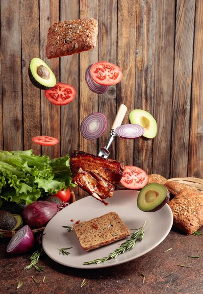 Flying Hot Grilled Meat Slices Onion Avocado Tomato Grilled Pork — Stock Photo, Image