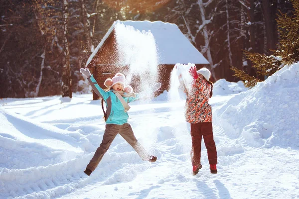 Two Little Girls Playing Winter Park Throwing Snowflakes Jumping — Stock Photo, Image