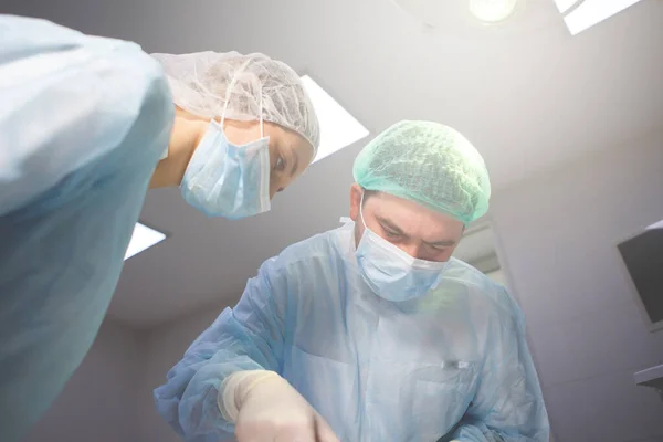 Team of surgeons doing surgery — Stock Photo, Image