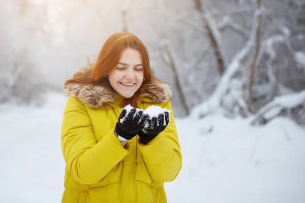 Young, pretty, cheerful red long-haired woman in winter outside. — Stock Photo, Image