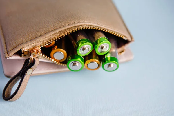 Energy storage, AA alkaline batteries are in the women\'s wallet.