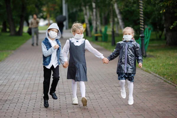 Schoolchildren Boy Girls Medical Masks Walk City Park First Time — Stock Photo, Image