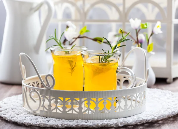 Fresh lemon drink with rosemary in glass cup — Stock Photo, Image