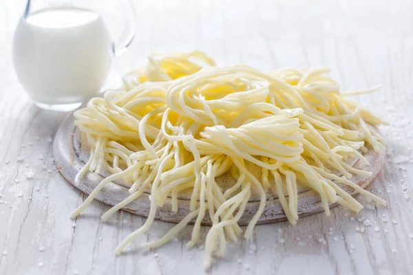 String cheese or cheese whip (korbaciky) - salty snack cheese, national delicacy from Slovakia. Made from cow or sheep milk