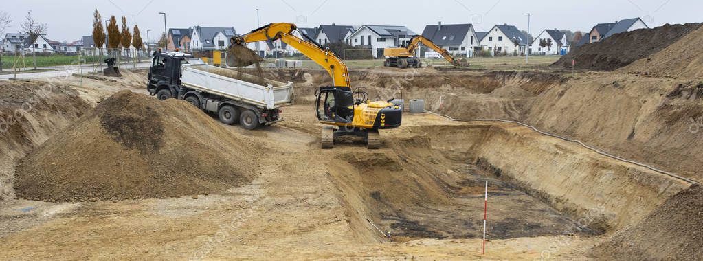 Digger and truck working in excavation pit — Stock Image Digger Truck Working Excavation Pit Royalty Free Stock Images