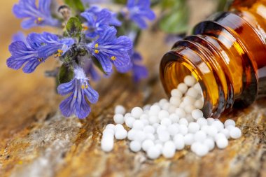 Alternative medicine with homeopathic pills clipart