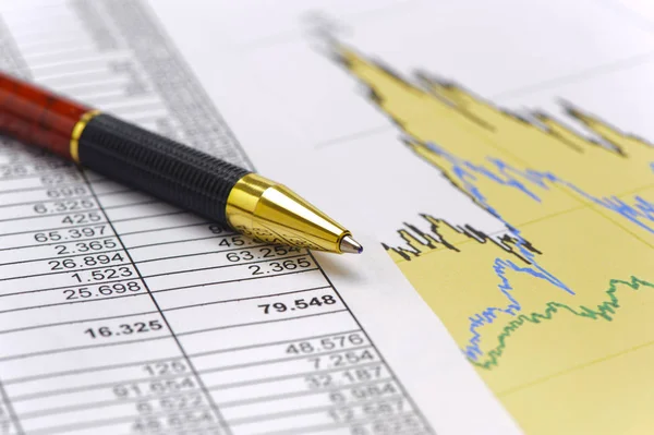 Financial calculation with chart of stock market — Stock Photo, Image