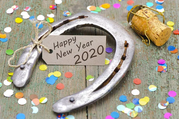 Happy new year 2020 with rusty horse shoe — Stock Photo, Image