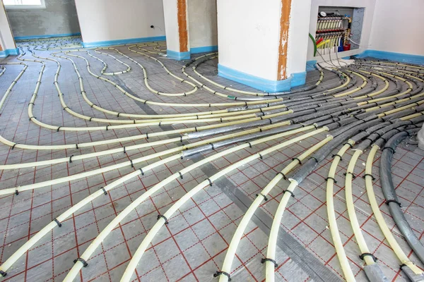 Underfloor heating in construction of new residential house — Stock Photo, Image