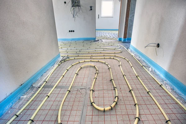 Underfloor heating in construction of new residential house — Stock Photo, Image