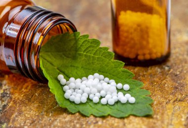 alternative medicine with homeopathy and herbal pills clipart