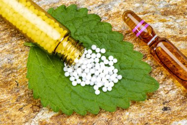  alternative medicine with homeopathy and herbal pills clipart