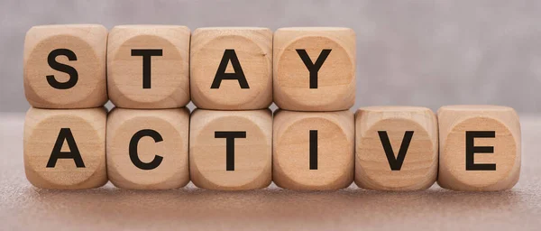 stay active printed on wooden cubes