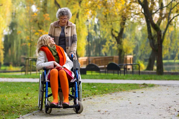 Happy Young Woman Wheelchair Old Woman Park Autumn — Stock Photo, Image