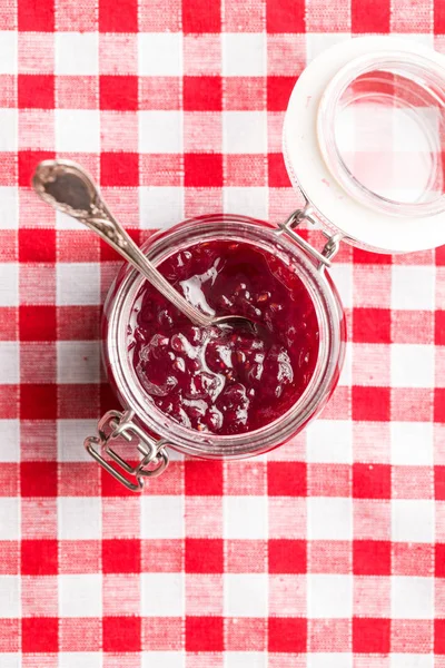 Raspberry Jam Jelly Jar Checkered Tablecloth — Stock Photo, Image