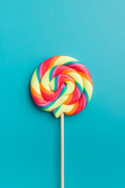 Colorful Rainbow Swirl Lollipop Blue Background — Stock Photo, Image