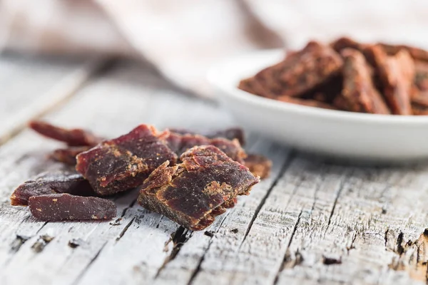 Beef Jerky Pieces Old Wooden Table Marinated Dried Meat — Stock Photo, Image